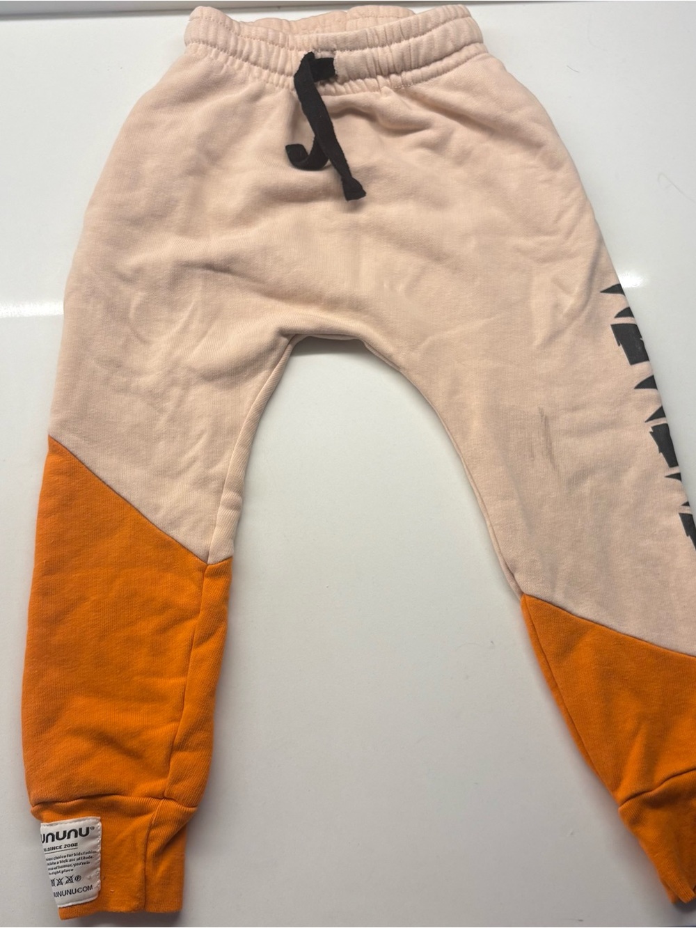 nununu Beige Hoodie with Black Drawstrings